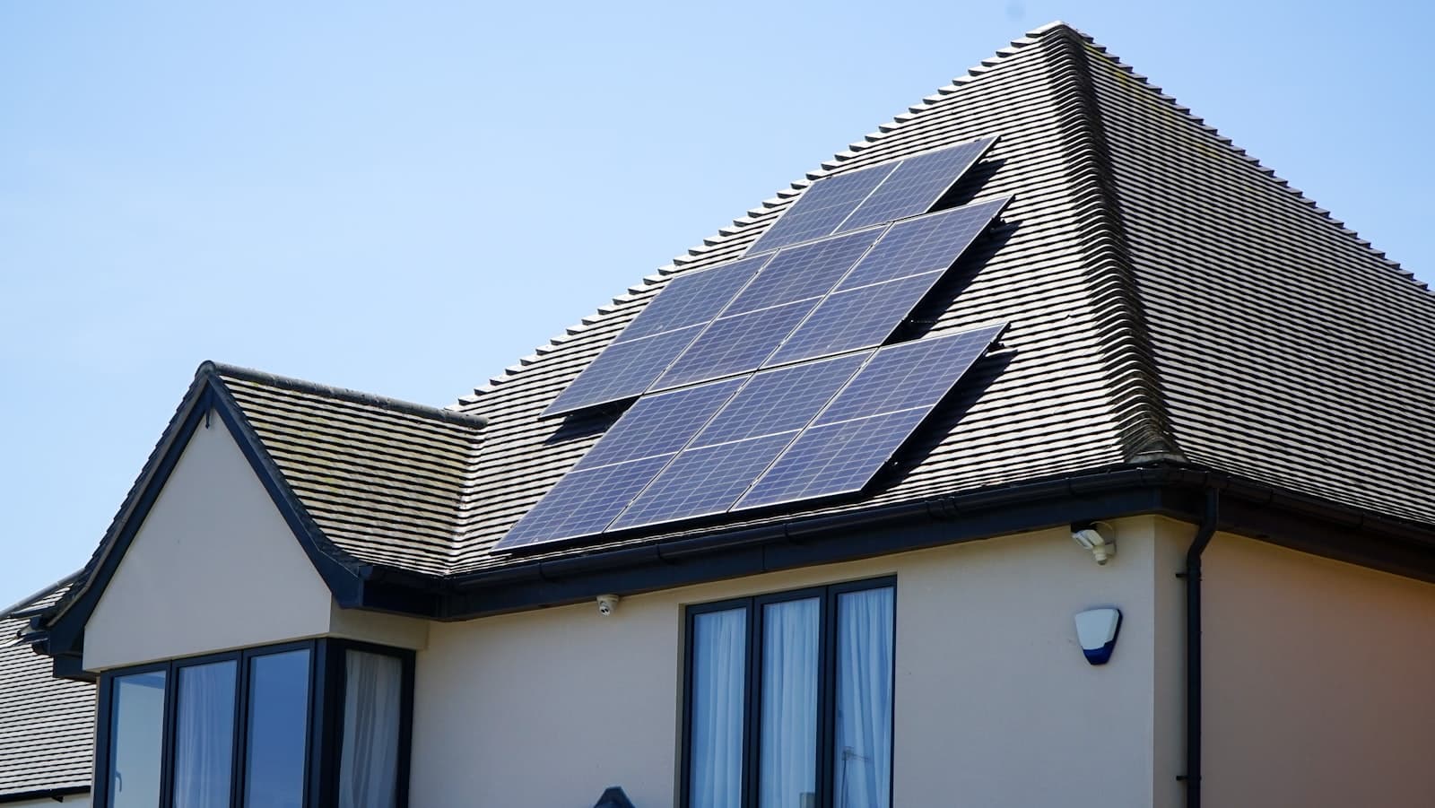 Solar panels on the tiled roof of a detached house