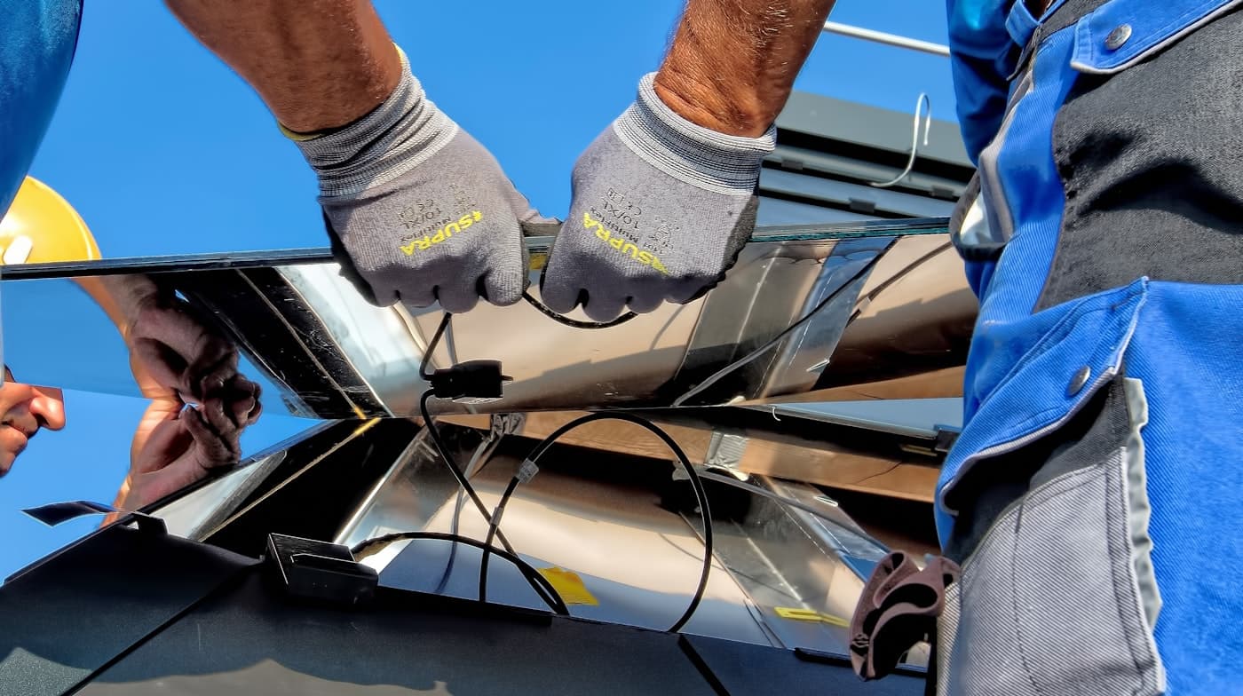 Vetted installer mounting a solar panel